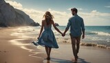 Fototapeta Sport - Couple holding hands on beach