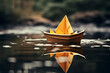 paper boat on the water