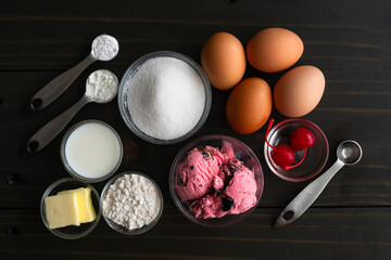 Wall Mural - Ingredients to Make Miniature Versions of Baked Alaska: Ice cream, eggs, sugar, and ingredients to make sponge cake and meringue for mini desserts