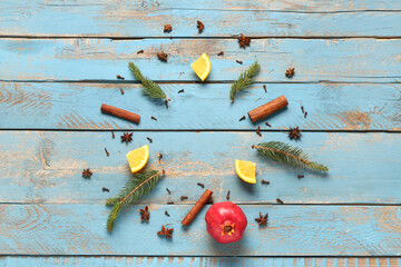 Wall Mural - Frame made of ingredients for preparing tasty mulled wine on blue wooden background