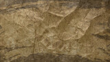 Fototapeta Desenie - Brown crumpled paper texture. Abstract background for design and decoration. Space for your text 