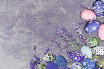 Canvas Print - Easter eggs. Purple, blue and golden eggs with lavender on a background.