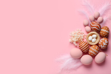 Poster - Composition with painted Easter eggs, nest and feathers on pink background