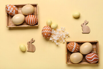 Poster - Wicker boxes with different painted Easter eggs on beige background