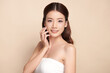© kitthanes - Beautiful young asian woman with clean fresh skin on beige background, Face care, Facial treatment, Cosmetology, beauty and spa, Asian women portrait.