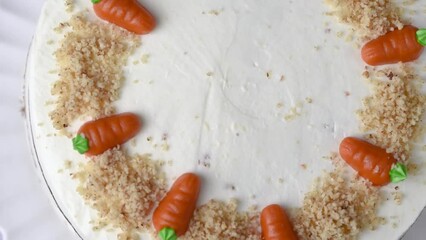 Wall Mural - Homemade Easter carrot cake made with walnuts, iced with cream cheese. Sweet dessert.  Plate with delicious carrot cake