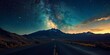 A highway under a sky full of stars, with a mountain range silhouette in the distance and the first light of dawn approaching