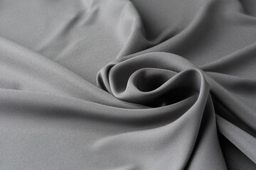 Texture of grey crumpled silk fabric as background, closeup