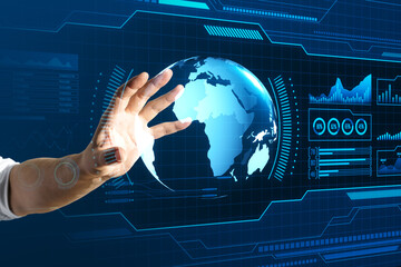 Wall Mural - Close up of businessman hand using holographic screen with digital globe interface and business chart on blurry blue background. HUD, international stock and future monitor concept.