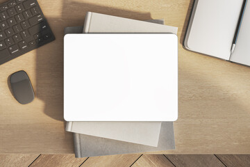 Poster - Top view of empty white tablet on wooden office desk with supplies and equipment. Mock up, 3D Rendering.