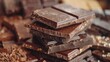 Top view of a pile of chocolate bars, assorted varieties, stacked neatly, rich brown hues