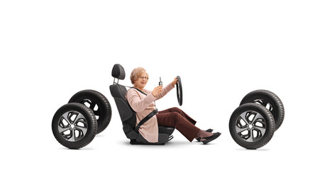 Poster - Elderly woman sitting in a car seat and showing a key