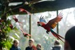 parrots flying in a zoo aviary as visitors look on
