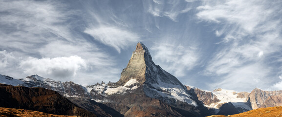 Wall Mural - Gorgeous view of Matterhorn peak in Swiss Alps. Hight mountains range with dramatic sky. Mountain panorama. Landscape photography