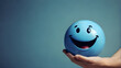 © big bro - Hands holding blue happy smile face copy spce