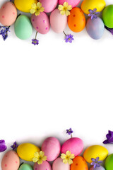 Wall Mural - easter decoration. easter eggs and blue flowers hepatica, violet crocuses, yellow primula on a white
