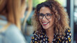 © Patrick - Happy mature professional business woman executive hr manager having job interview or business discussion with female applicant or colleague sitting at workplace in corporate office meeting.