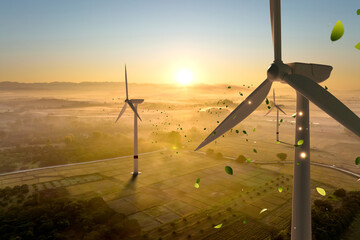 Wall Mural - Aerial view of wind turbines on agricultural fields at sunrise, symbolizing sustainable energy and climate action. Clean, renewable power blending with agriculture in landscape of innovation