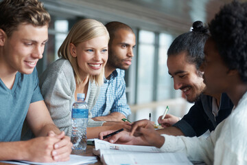 Canvas Print - Education, people at university and students studying together, share ideas and research for project in library. Happy, academic discussion for assignment on campus and diversity with scholarship