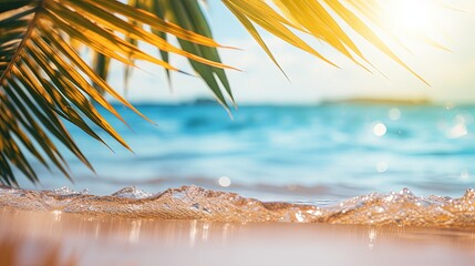 Wall Mural - Beautiful background for summer vacation and travel. Golden sand of tropical beach, blurry palm leaves and bokeh highlights on water on sunny day
