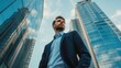 © Intelligence Studio - man in business suit standing in front of a big office building