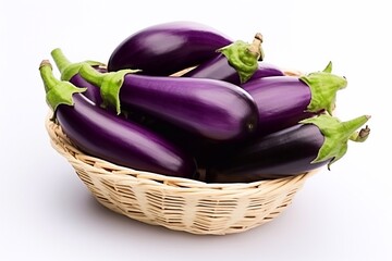 Wall Mural - Tasty and useful. Organic Eggplants in a Basket on White Background