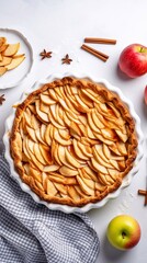Wall Mural - Homemade Apple Pie with fresh apples on white kitchen table, top view, flat lay. Thanksgiving traditional dessert, Thanksgiving tart preparation, autumn bakery. Crispy weather sweets. Recipe