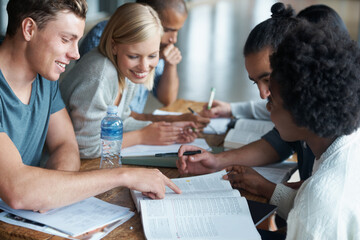 Canvas Print - Education, college and students studying and reading together, share ideas and research for project. People in library, academic discussion for assignment on campus, diversity and scholarship