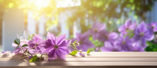 Sticker - Natural summertime cooking template fresh green leaves and violet flowers of clematis over an empty empty table with violet checkered tablecloth on a sunny day with copy space. Creative Banner