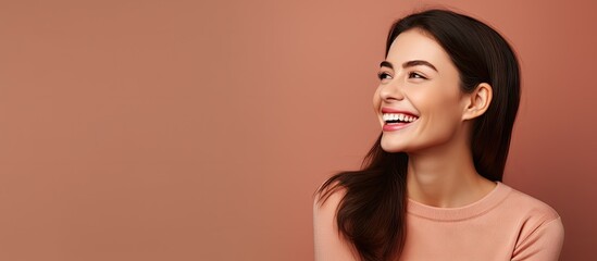 Canvas Print - White teeth Close up photo of a nice girl with raven black hair who is looking in the camera with a broad smile and pointing with her right index finger at her teeth. Creative Banner. Copyspace image