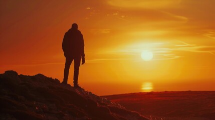 Poster - A person standing on top of a mountain, enjoying the breathtaking view of the sunset. Perfect for travel and adventure themes