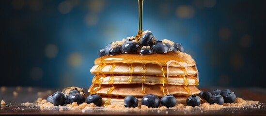 Poster - Pouring honey on stack of pancakes Homemade oat pancakes with blueberries. Creative Banner. Copyspace image