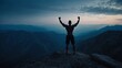silhouette of a sportsman raising hands up on the top  of mountain, blue atmosphere, success concept