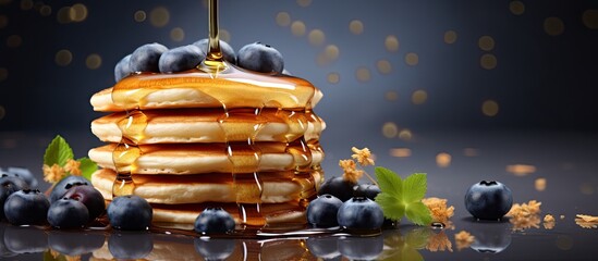 Sticker - Pouring honey on stack of pancakes Homemade oat pancakes with blueberries. Creative Banner. Copyspace image