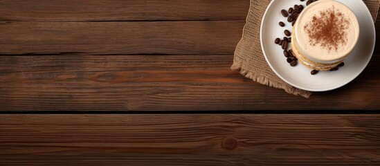 Poster - Tiramisu dessert and coffee on wooden table Top view with copy space. Creative Banner. Copyspace image
