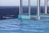 Fototapeta Miasto - View across infinity pool on cruise ship