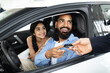 © Prostock-studio - Cheery young family buying new vehicle at modern showroom