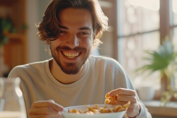 Poster - A man is sitting at a table with a bowl of food. This image can be used to represent dining, mealtime, or enjoying a meal