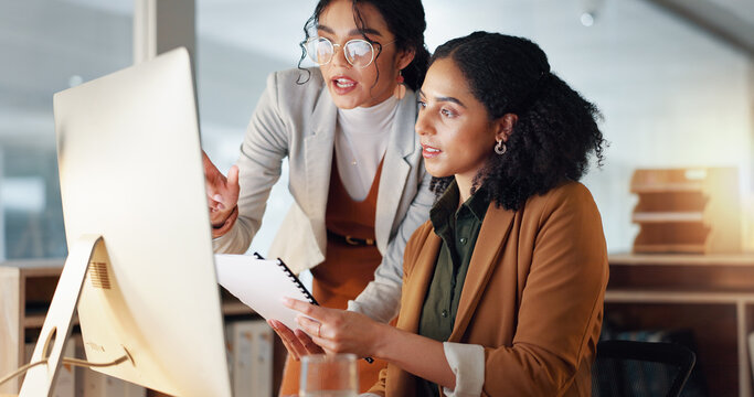 Communication, coaching and women in business with documents for training and project management on laptop. Instruction, mentor or leader talking to colleague with paperwork for report in office