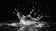 A captivating black and white photo capturing a splash of water. Ideal for various creative projects and designs