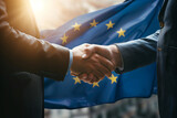 Fototapeta Na drzwi - Successful businessmen handshaking after good deal. Business partnership meeting concept. Flag of European Union on a background.