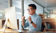 © SneakyPeakPoints/peopleimages.com - Happy asian man, fist pump and celebration for winning, promotion or bonus on computer at office. Excited male person or employee wow in achievement, target or good news for victory, success or deal