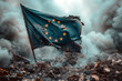 A tattered European Union flag waves on a pile of rubble in a smoky, destroyed area.