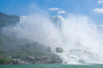 Wall Mural - Clouds of splashes and falling water from Niagara Falls, Niagara State Park