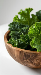 Wall Mural - kale leaves in a wooden bowl