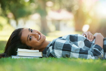 Wall Mural - Portrait, grass or happy woman in park with books for learning knowledge, information or education. Smile, textbook or student in nature for studying break or peace on college campus lawn to relax