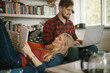 © Marko Geber - Couple studying at home with laptop and notebook