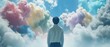a man standing in the middle of a cloud filled sky, looking up at a sky full of colorful clouds.