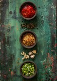 Fototapeta Mapy - three bowls filled with different types of food on top of a green surface with a rusted surface behind them.