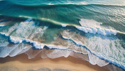 Wall Mural - Aerial view of seascape. Blue ocean water with waves. Beautiful sandy beach from drone.